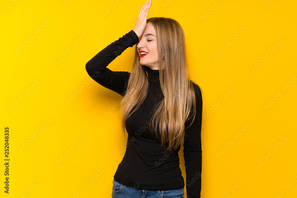 Young pretty woman over yellow background has just realized something and has intending the solution Young pretty woman over yellow background has just realized something and has intending the solution