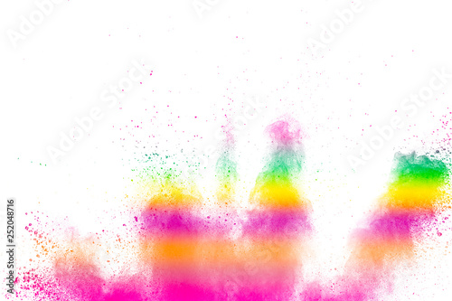 Abstract multi color powder explosion on white background. Freeze motion of dust particles splashing. Painted Holi in festival.