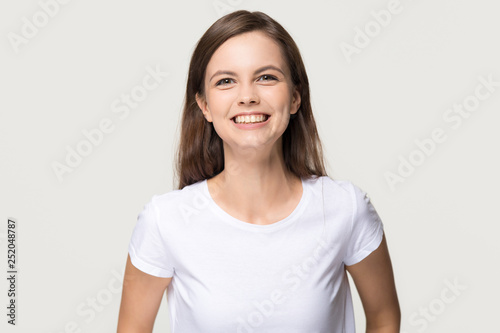 Happy cheerful girl looking at camera isolated on background
