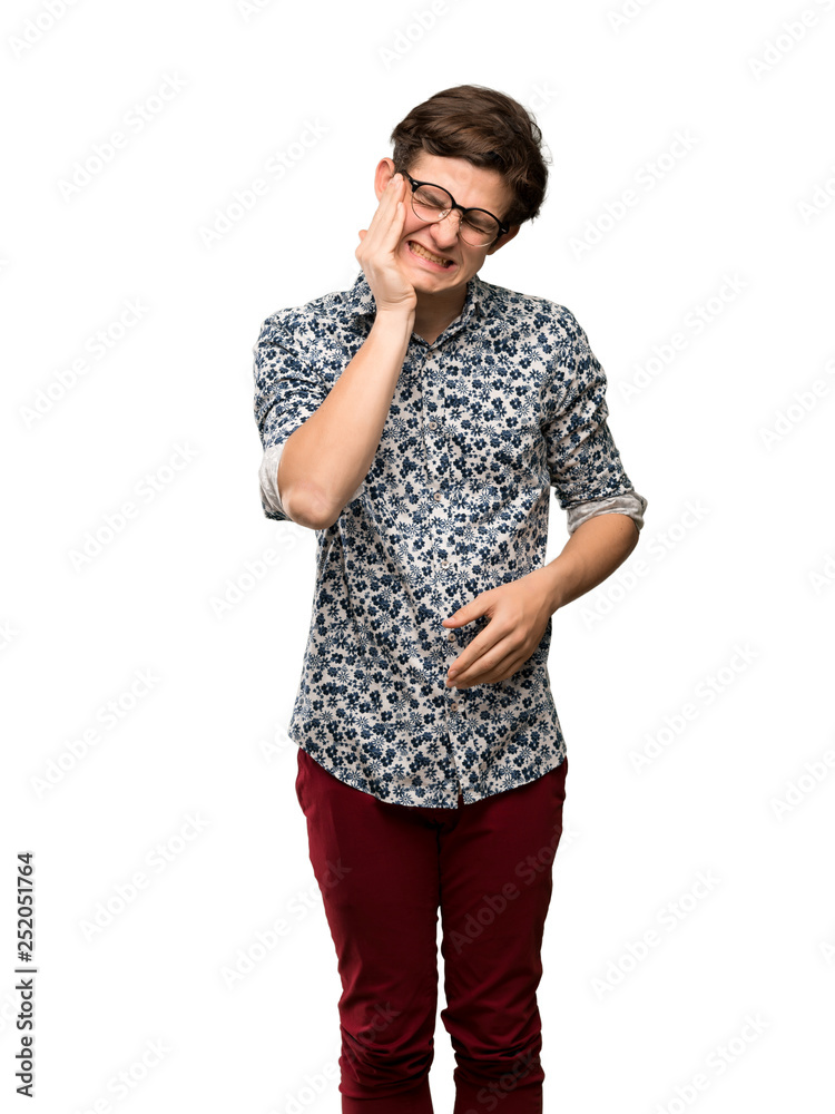 Teenager man with flower shirt and glasses with toothache over isolated white background Teenager man with flower shirt and glasses with toothache over isolated white background