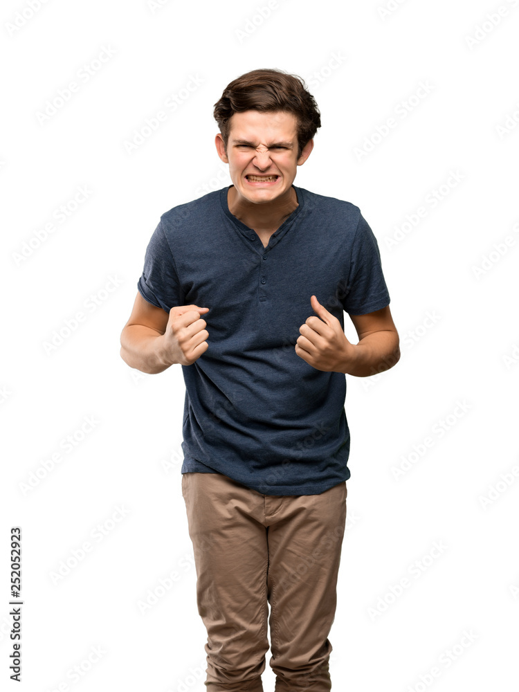 Teenager man frustrated by a bad situation over isolated white background