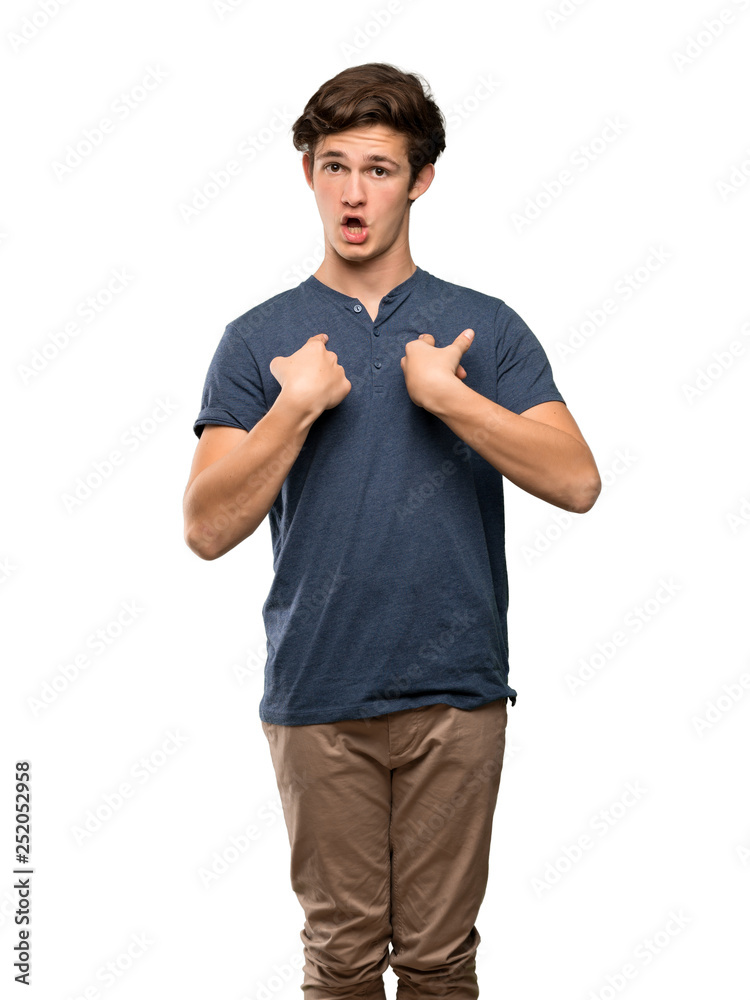 Fototapeta premium Teenager man with surprise facial expression over isolated white background