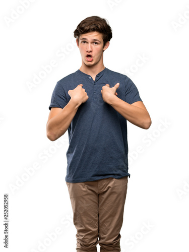 Teenager man with surprise facial expression over isolated white background