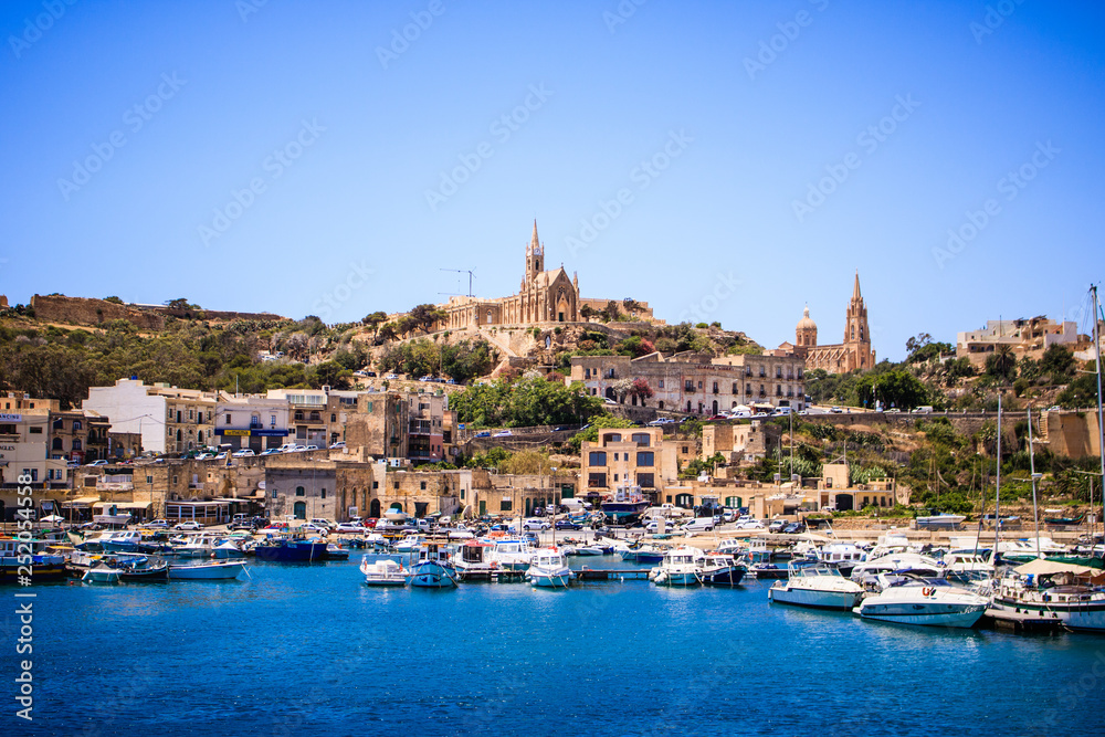 Naklejka premium Beautiful view on Gozo island from a boat, postcard style, beautiful colors landscape - Image