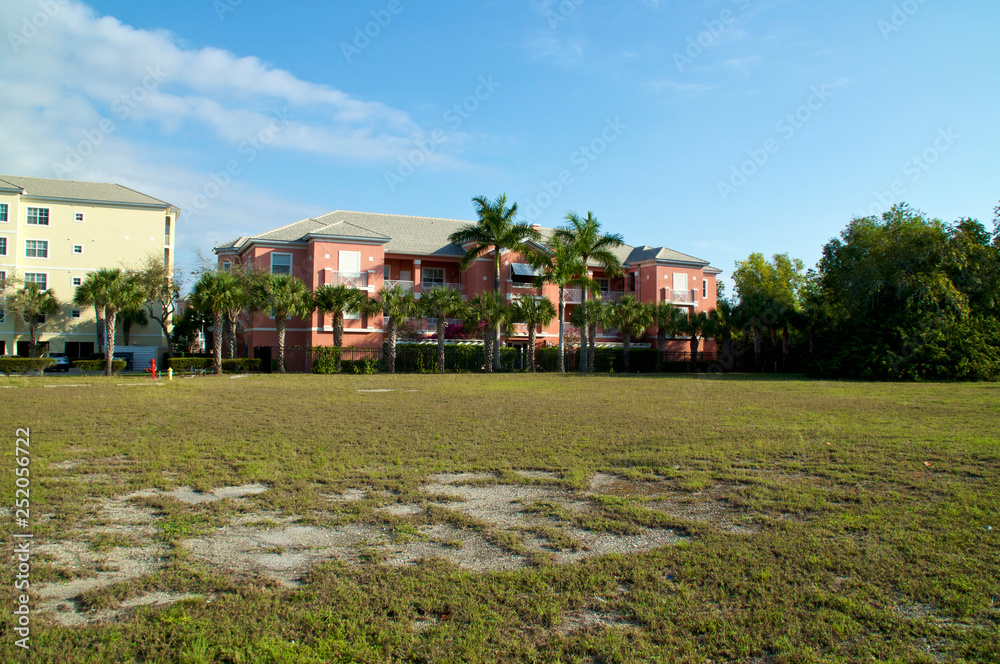 View of typical generic apartment buildings or condos in sub tropical Bonita Springs florida on a sunny winter morning.