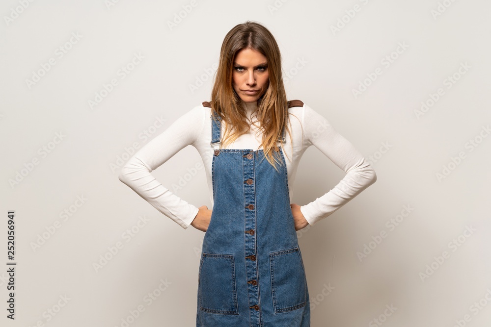 Obraz premium Beautiful woman over isolated white wall angry