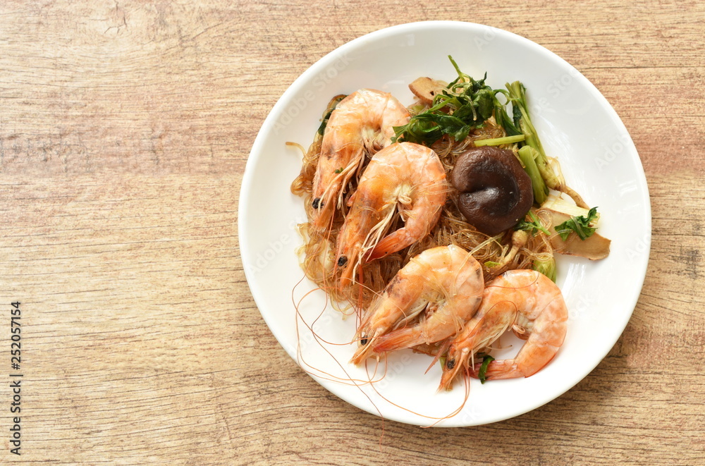 shrimp steamed with glass noodle and ginger on white plate shrimp steamed with glass noodle and ginger on white plate