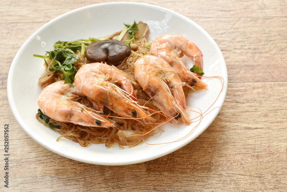 shrimp steamed with glass noodle and ginger on white plate shrimp steamed with glass noodle and ginger on white plate