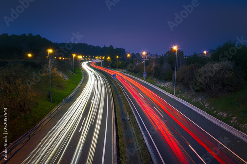 Car light trails at night in Berango