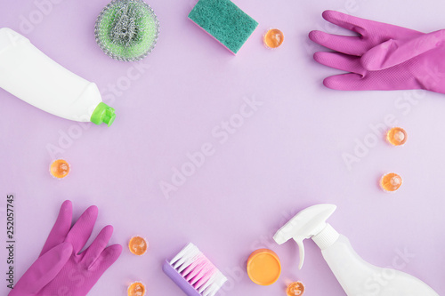  Cleaning tools. Flat lay on purple background. Housework concept. Cleaning Products. 
