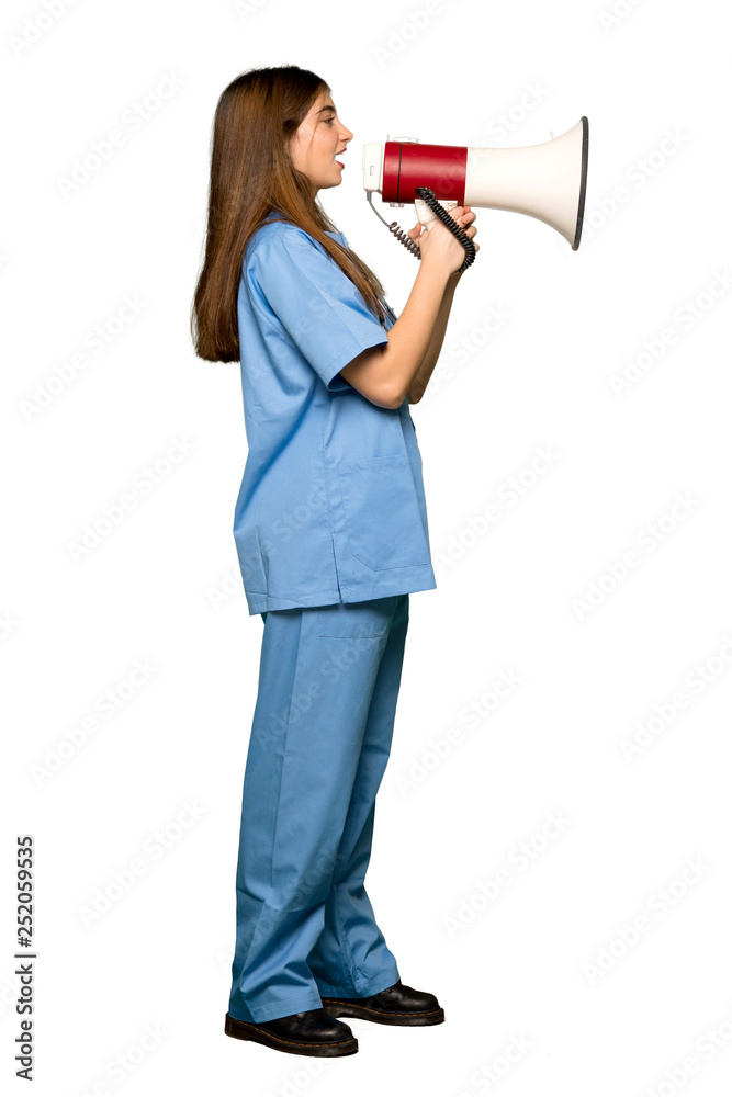 Full-length shot of Young nurse shouting through a megaphone on isolated white background Full-length shot of Young nurse shouting through a megaphone on isolated white background