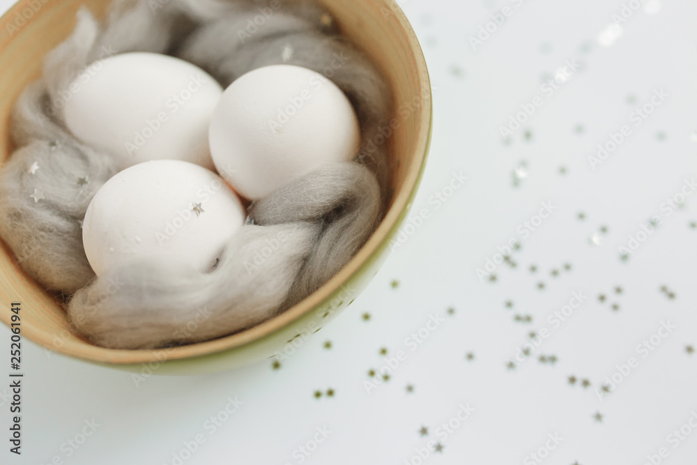 Easter. Easter eggs. Bokeh. Silver. Bowl with eggs Easter. Easter eggs. Bokeh. Silver. Bowl with eggs