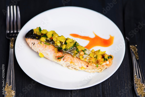 red fish salmon grilled with vegetables and sweet and sour sauce