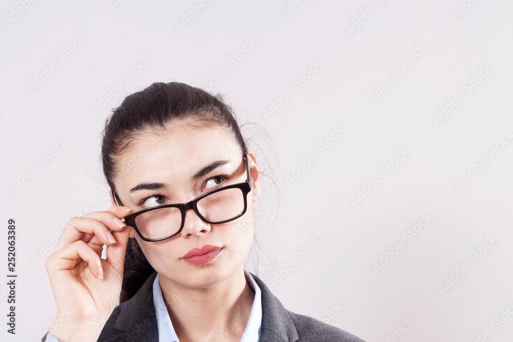 Young businesswoman on gray background Young businesswoman on gray background