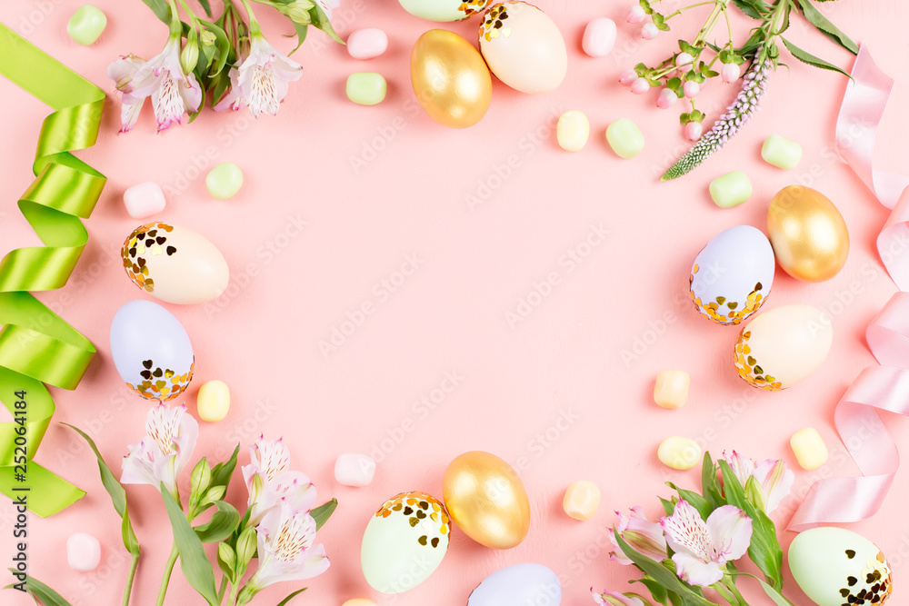 Festive Happy Easter background with decorated eggs, flowers, candy and ribbons in pastel colors on pink. Copy space Festive Happy Easter background with decorated eggs, flowers, candy and ribbons in pastel colors on pink. Copy space