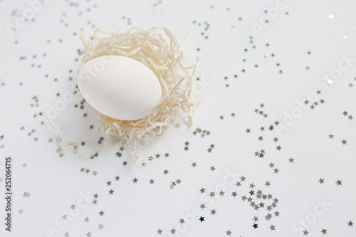 Easter. White Easter Egg. Silver. Bokeh.
