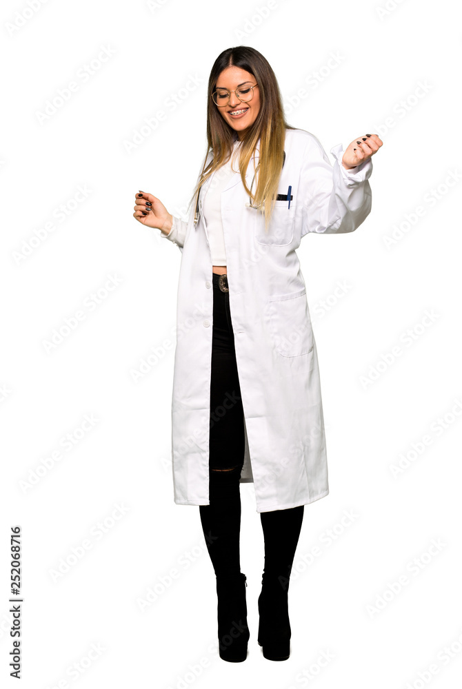 Full body of Young doctor woman enjoy dancing while listening to music at a party Full body of Young doctor woman enjoy dancing while listening to music at a party