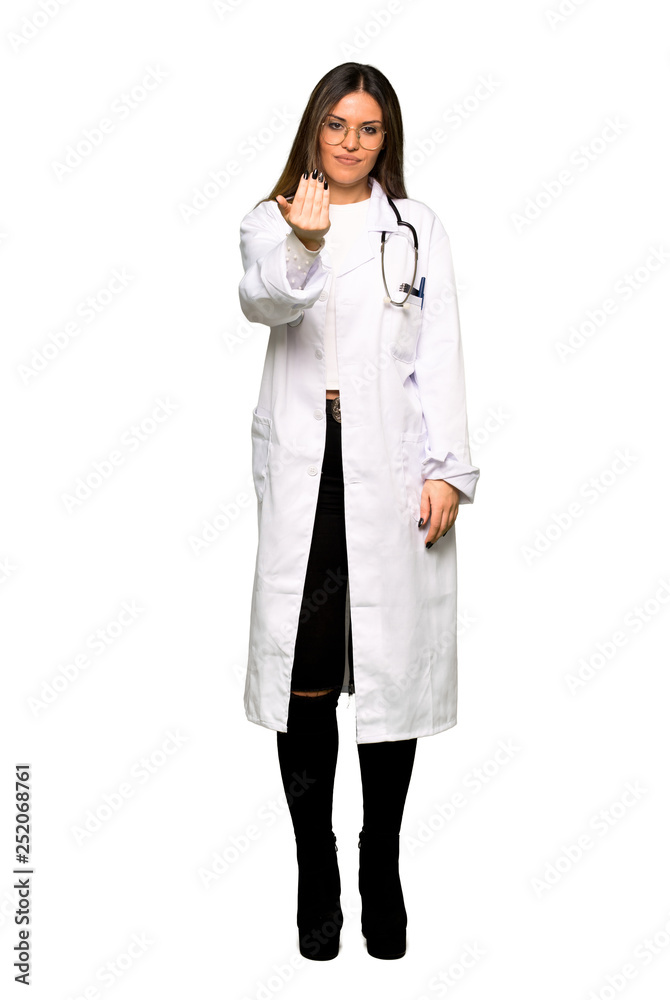 Full body of Young doctor woman inviting to come with hand. Happy that you came Full body of Young doctor woman inviting to come with hand. Happy that you came