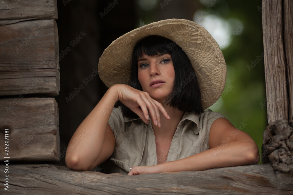 Portrait of an attractive Caucasian young female wearing a hat