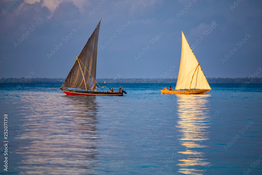 Two sailboats on the water surface.  Zanzibar island , Tanzania, Africa.
