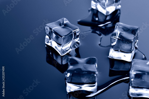 Pieces of crushed ice cubes on black background.