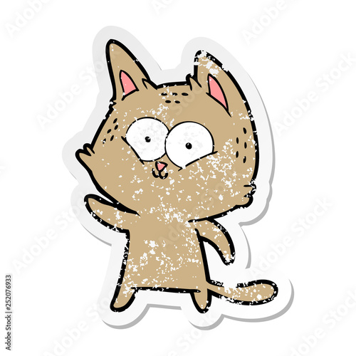 distressed sticker of a cartoon cat waving