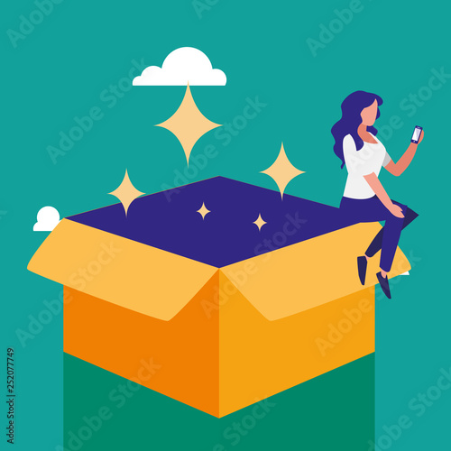 woman using smartphone with carton box