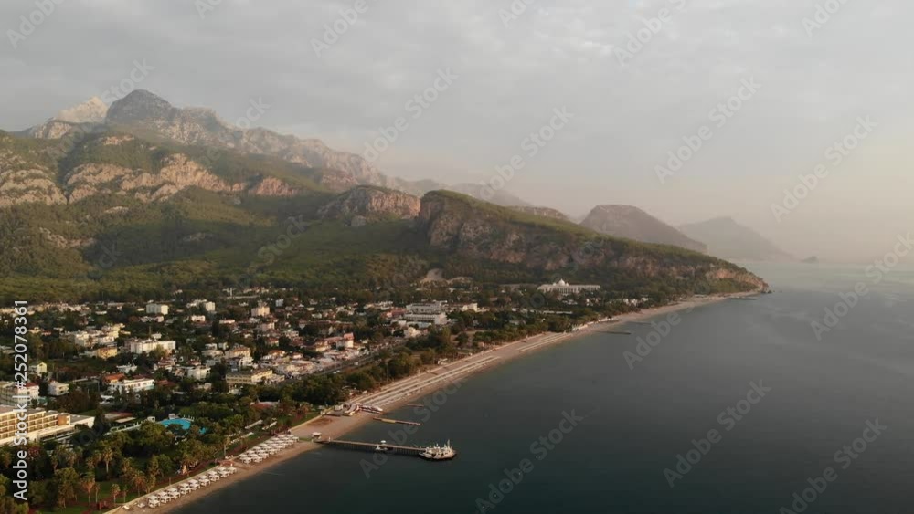 4k Aerial drone shot of Kemer coastline with turquoise water and numerous hotels at sunset 4k Aerial drone shot of Kemer coastline with turquoise water and numerous hotels at sunset
