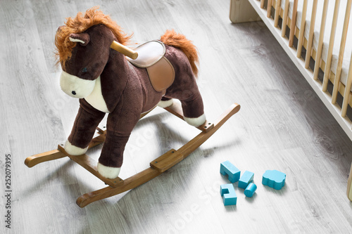 Rocking horse, crib at playroom
