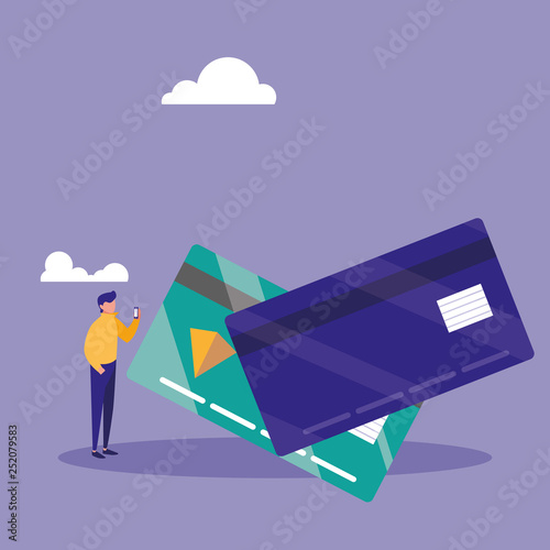 young man using smartphone with credit card