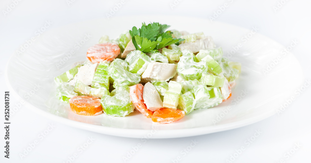 Fresh delicious healthy salad with celery, carrot and meat on white Fresh delicious healthy salad with celery, carrot and meat on white