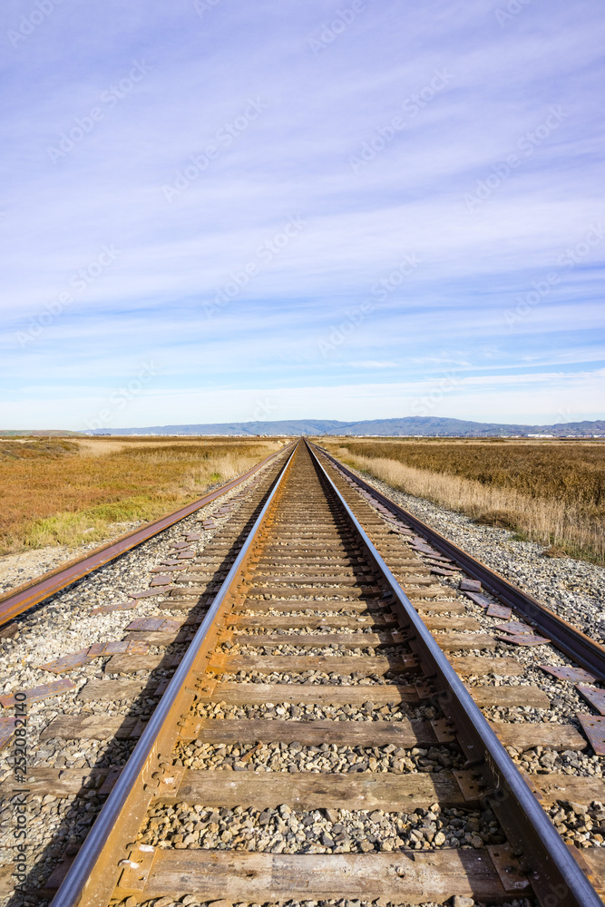 Railroad tracks across marshland, Alviso, San Jose, south San Francisco bay area, California