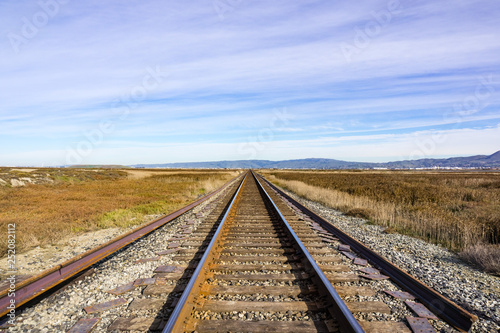 Railroad tracks across marshland, Alviso, San Jose, south San Francisco bay area, California