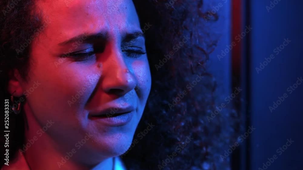 woman with broken heart weeps desperately in the dark,thinking of her ex-husband woman with broken heart weeps desperately in the dark,thinking of her ex-husband