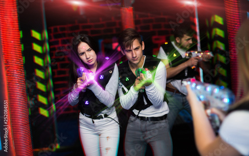 Couple playing laser tag