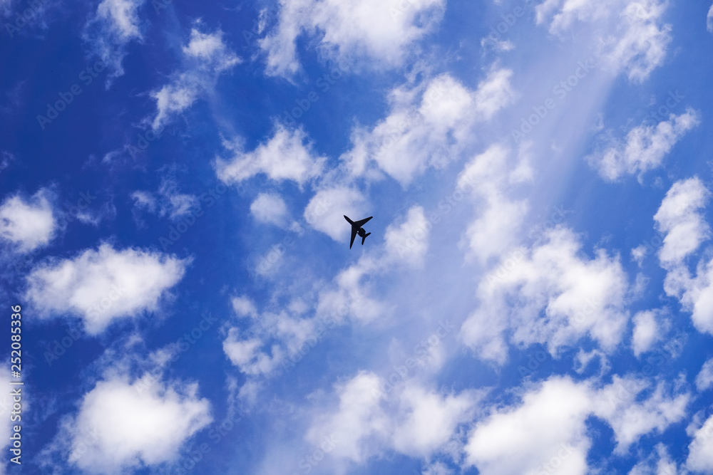 Airplane flying on a cloudy sky background Airplane flying on a cloudy sky background