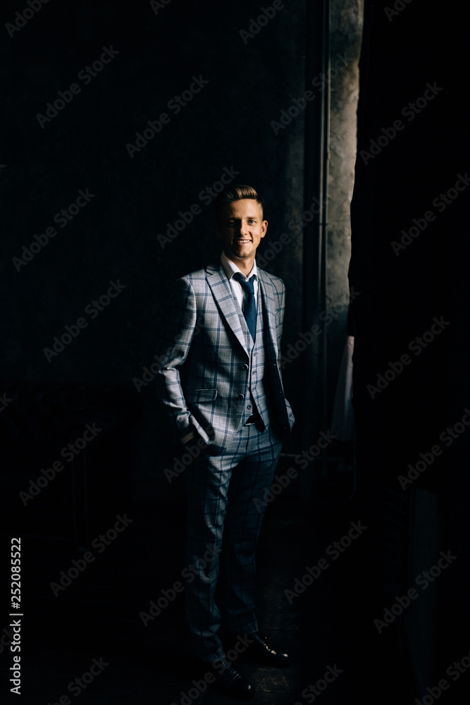 Man posing in a suit. Lateral hard light. Man posing in a suit. Lateral hard light.