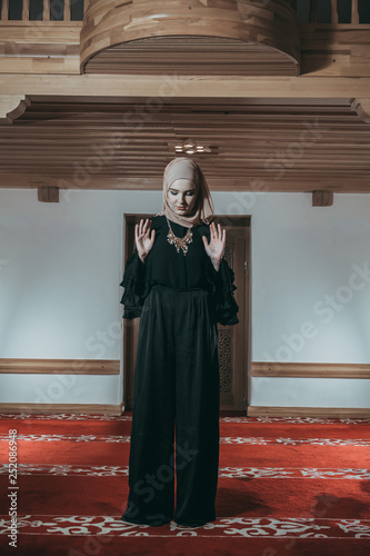 Muslim girl pray in mosque