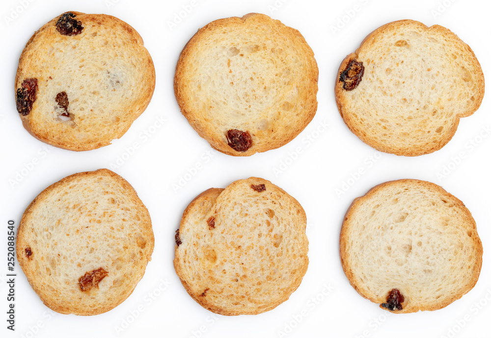 Mini round toasts of bread with raisins. 6 units. Isolated on white background. Mini round toasts of bread with raisins. 6 units. Isolated on white background.