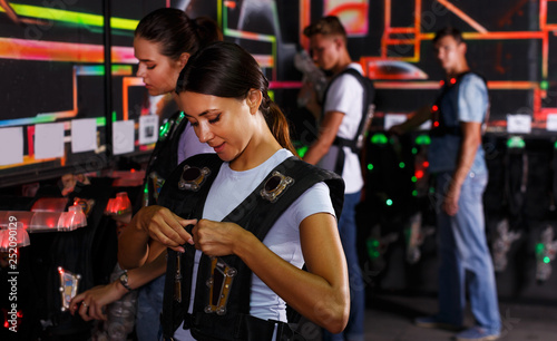 people looking laser guns and clothes together