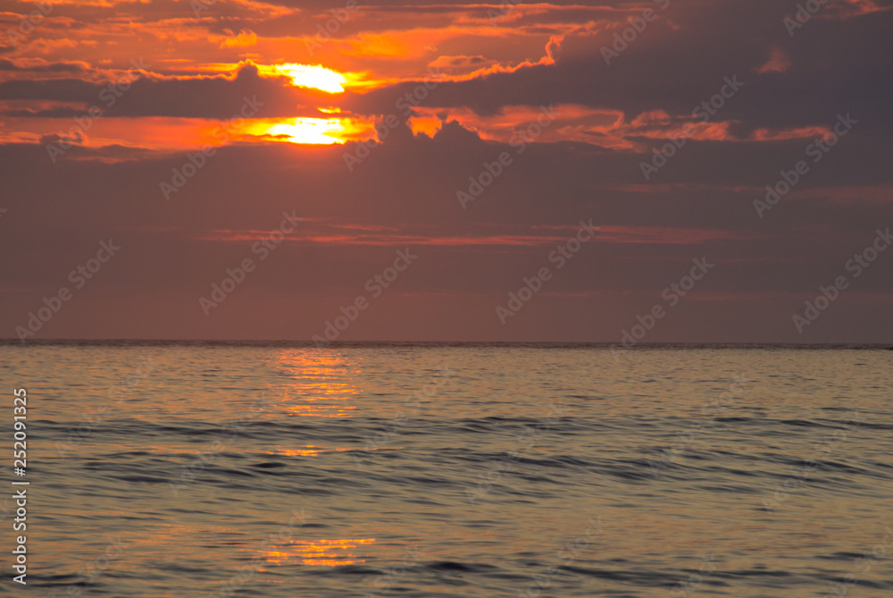 Fototapeta premium sunset on Unstad beach surrounded by mountains in Lofoten in Norway