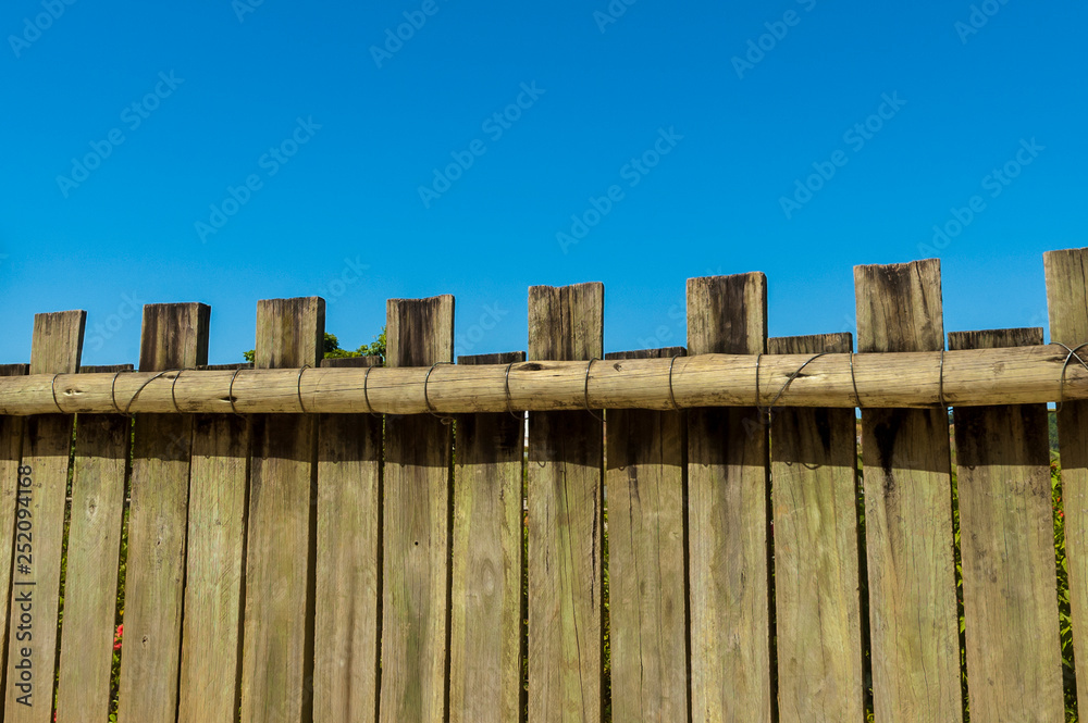 wooden fence with blue sky and clouds wooden fence with blue sky and clouds