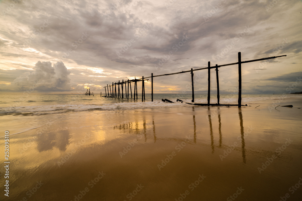Beautiful sunset with old wooden bridge at Khao Pilai in Phang- Nga Province, Thailand