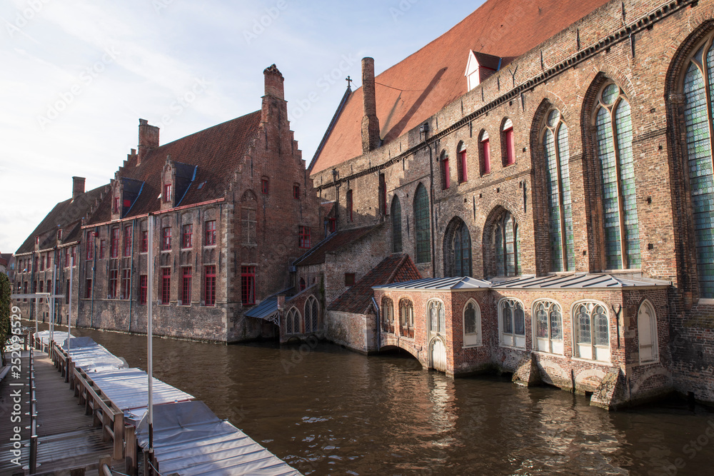 Detail of a typical old house in Bruges, Belgium, on the waterfront