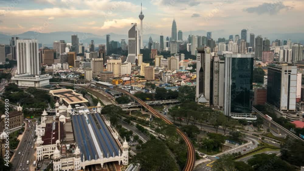 4K Cinematic Zooming In to LRT Station Time Lapse Footage of Kuala Lumpur City Skyline during a 