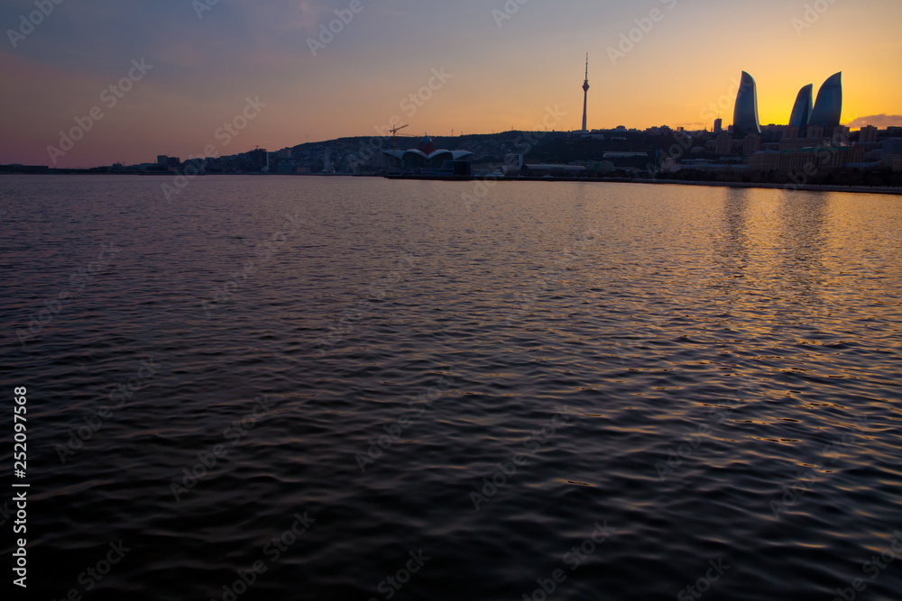 Fototapeta premium Sunset of Baku, Azerbaijan . Fire towers in the night