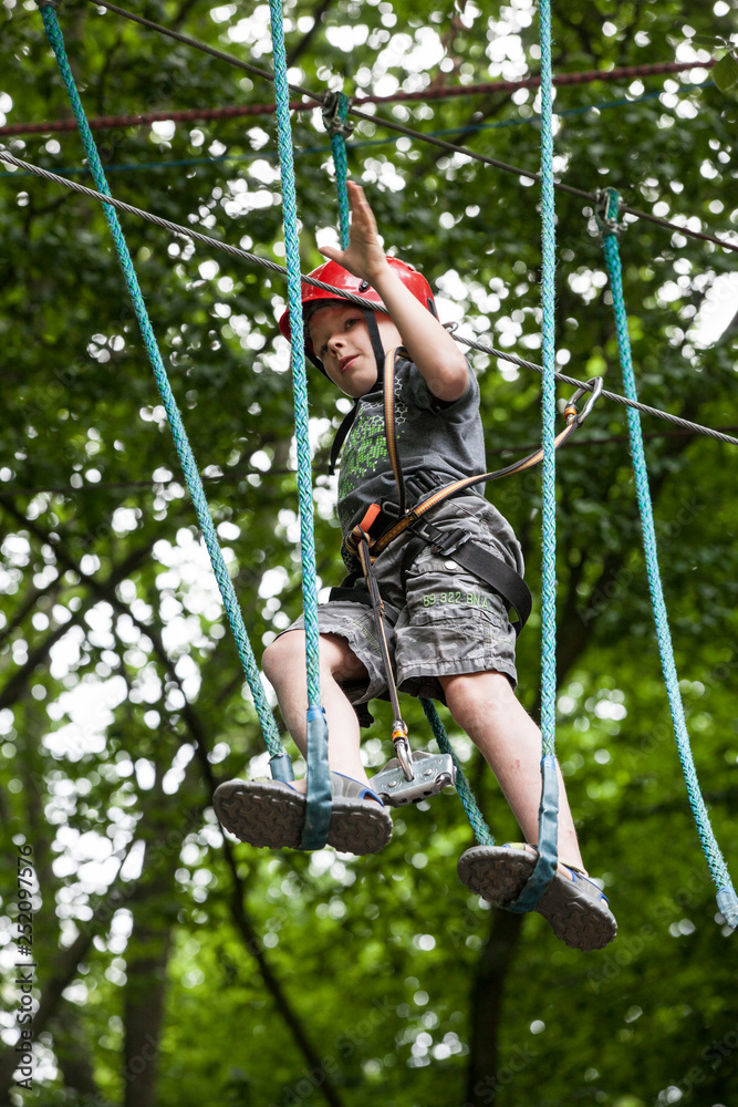 Young teenage boy in a rope park