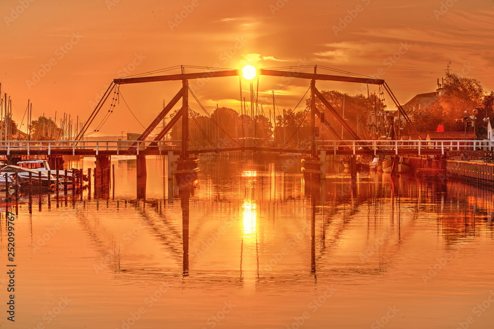 wooden bridge in Greifswald Wieck sunset scenery wooden bridge in Greifswald Wieck sunset scenery