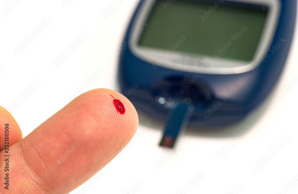 Fototapeta premium Drop of blood on the patient finger for make glucose level blood test.