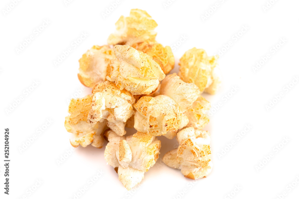 A Pile of Cinnamon Toast Flavored Popcorn on a White Background A Pile of Cinnamon Toast Flavored Popcorn on a White Background